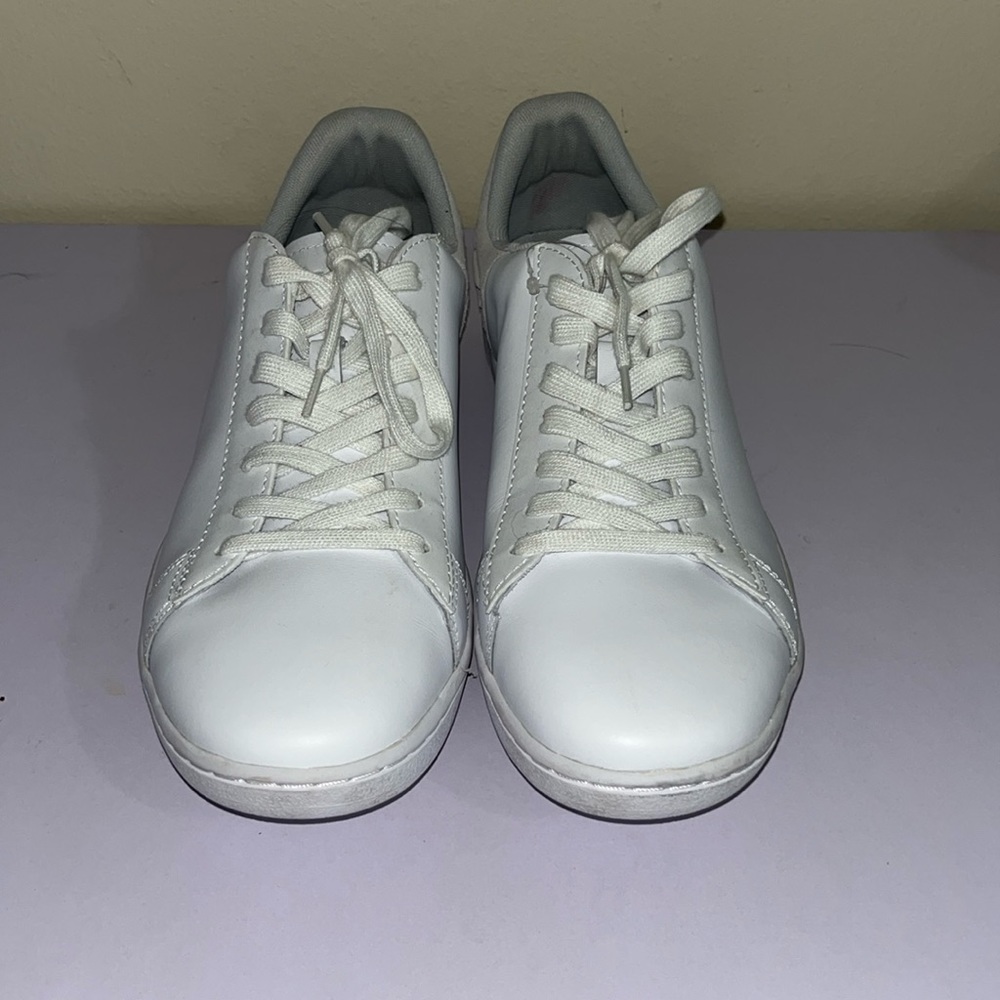 White size 9 women’s Lacoste leather sneakers